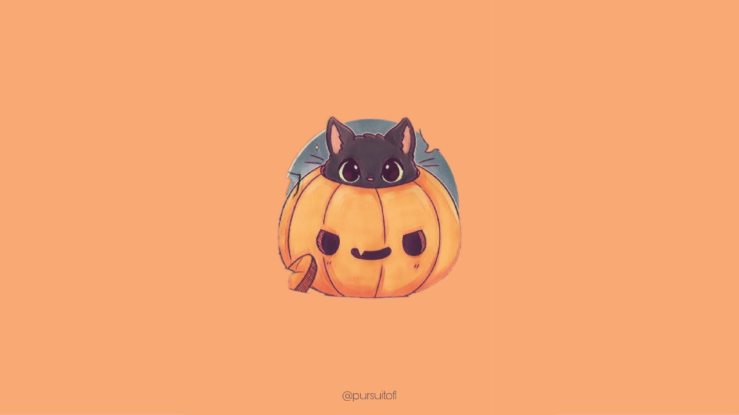 Orange Halloween Desktop wallpaper with a kitten inside of a carved pumpkin