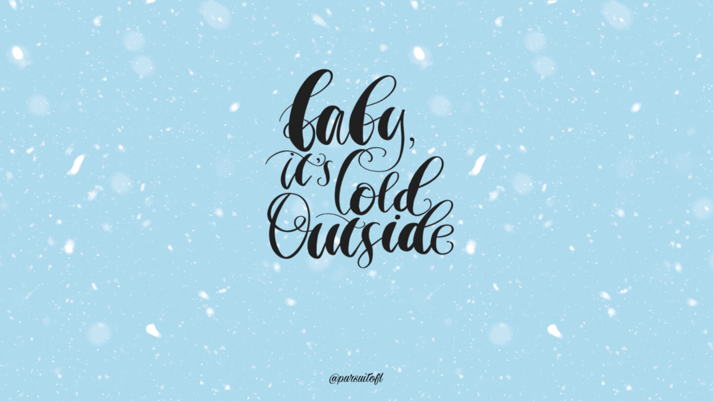 Light Blue Desktop Wallpaper with White Snow and Baby It's Cold Outside Text