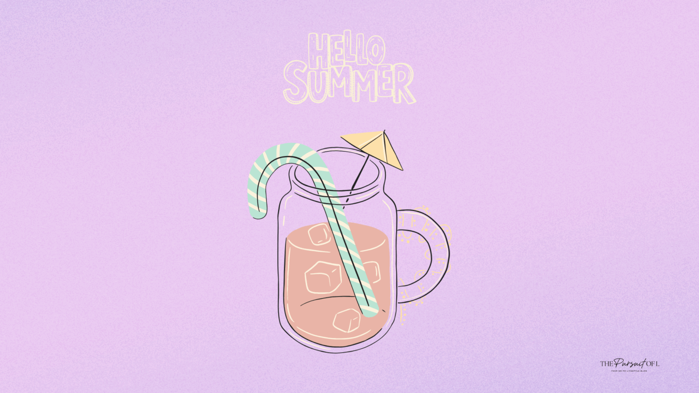 A playful desktop wallpaper with a mason jar of iced coffee or tea, topped with a paper umbrella and a mint green striped straw. The words ‘Hello Summer’ glow above the drink on a soft lavender background.